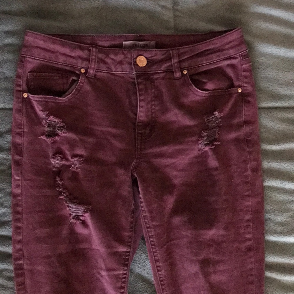 Red/purple ripped jeans